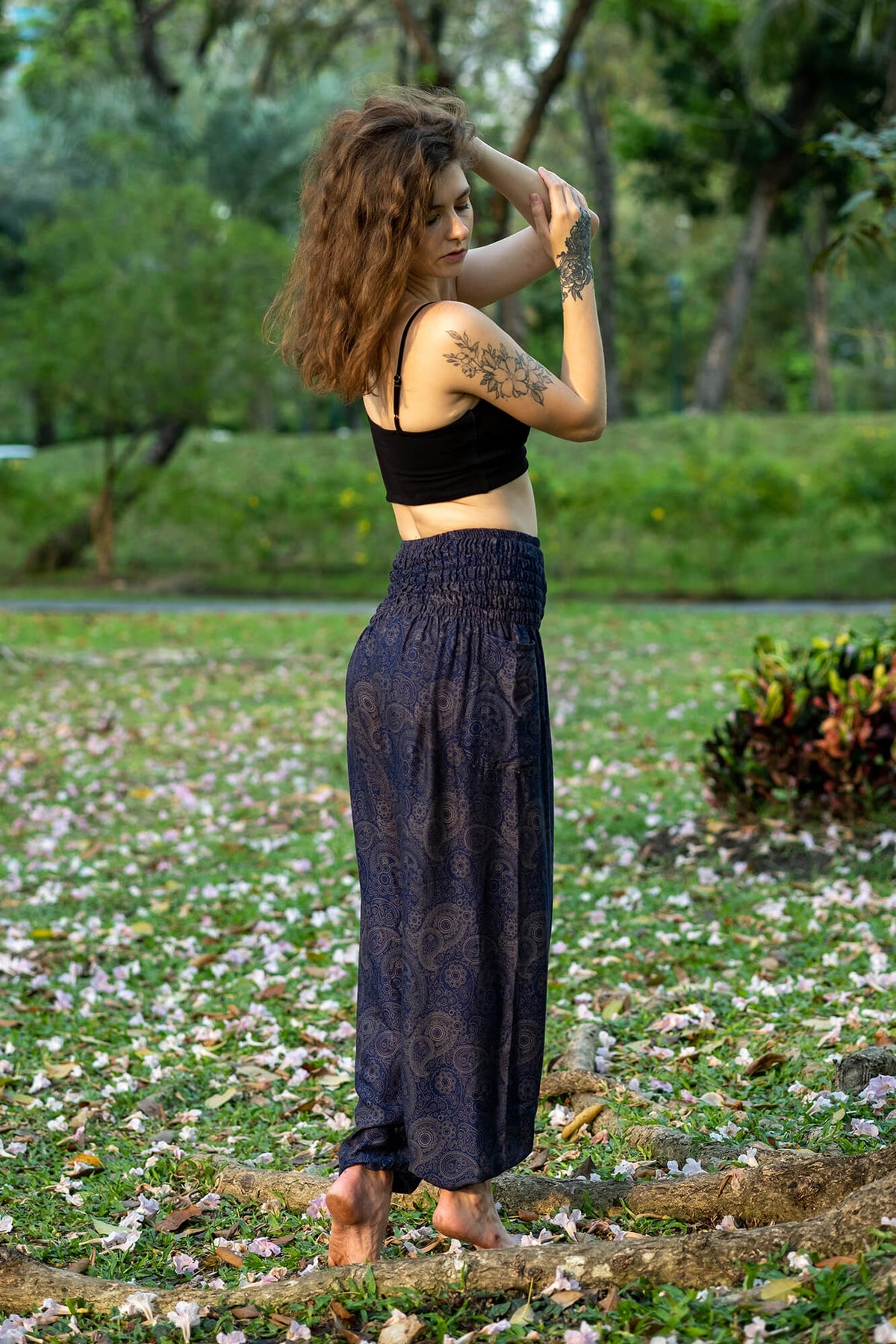 Navy rayon flow pants with all-over paisley print and gathered elastic waist